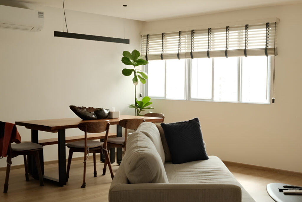 white with black ladder tape colonial style venetian blinds in a living and dining room