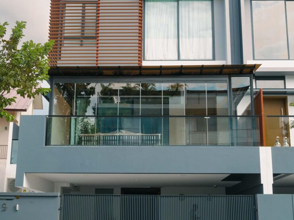 semi detached with clear glass curtains and tinted polycarbonate roofing on terrace