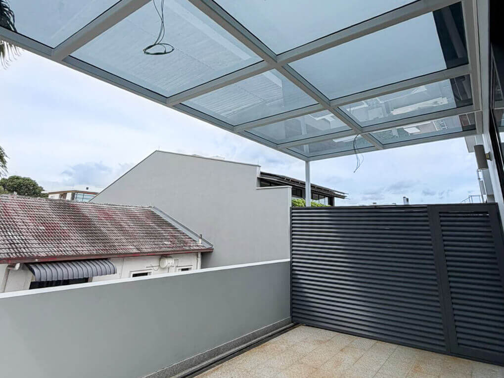tinted polycarbonate roof installed in terrace house