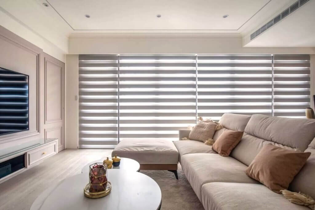 grey combi blinds on large windows in a modern living room