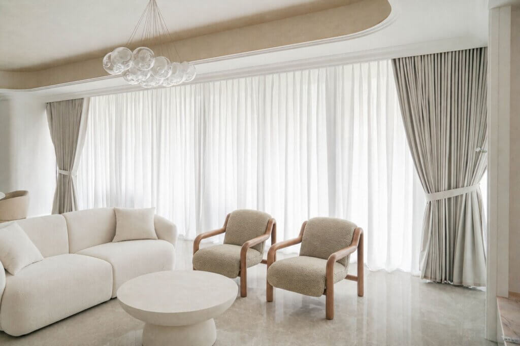 Sheer day and grey night curtains in a luxurious living room